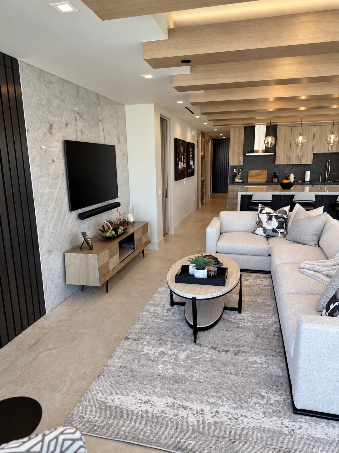 Residential living area with recessed and indirect ceiling lighting